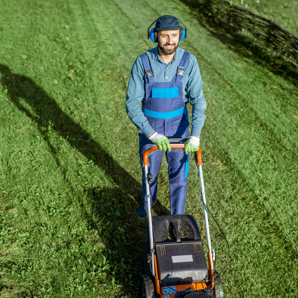 gardener-working-with-lawn-mower-on-the-backyard-2026-01-09-00-50-52-utc